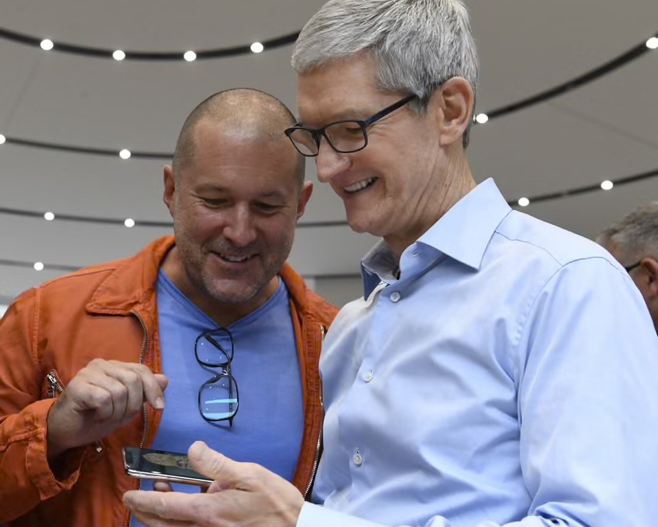 Jony Ive (left) and Tim Cook, Apple’s chief executive, inspect an iPhone in 2017. Photograph: Bloomberg/Getty Images